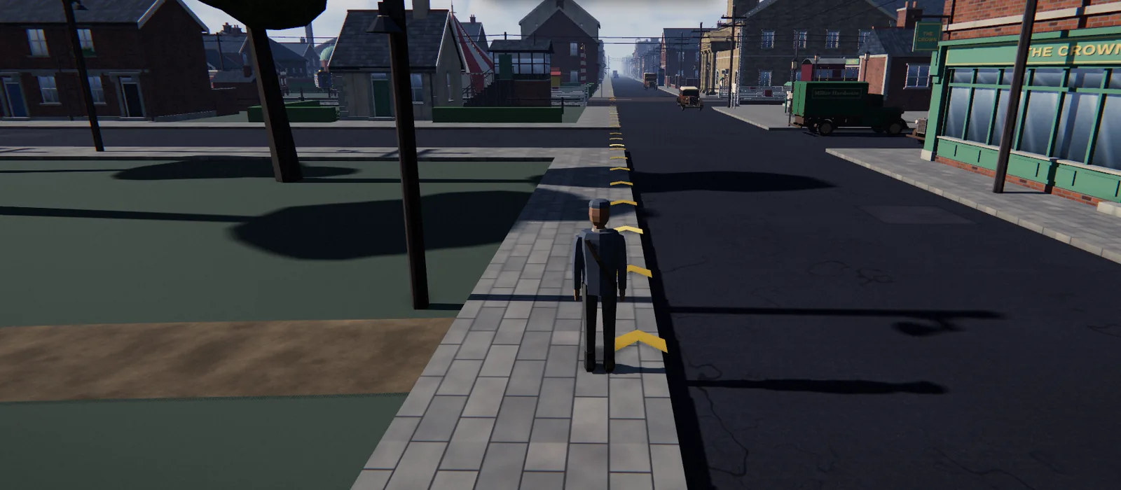 A sunny street with The Crown pub on the right, a clock tower ahead and gold arrows on the pavement