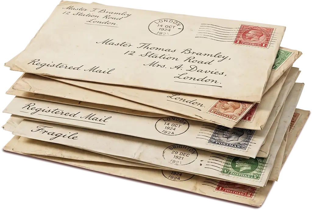 A stack of old hand-addressed letters with stamps and postmarks