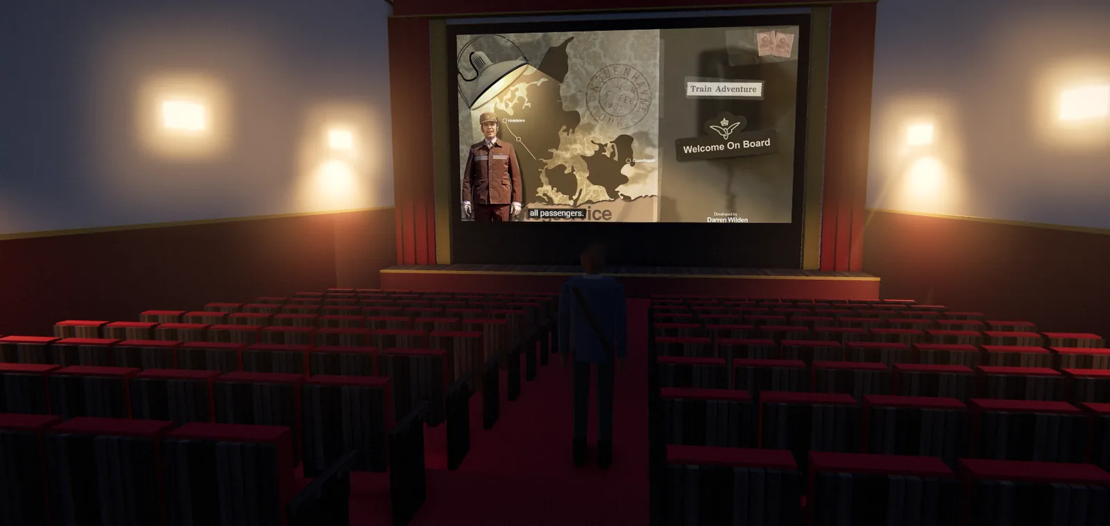 The Regal cinema auditorium, rows of red seats facing a screen showing a film about a Danish train journey